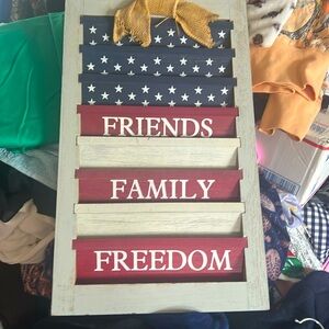 Wooden red white and blue sign    FRIENDS FAMILY AND FREEDOM